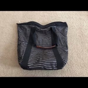 Black and gold bath and Body Works Bag.